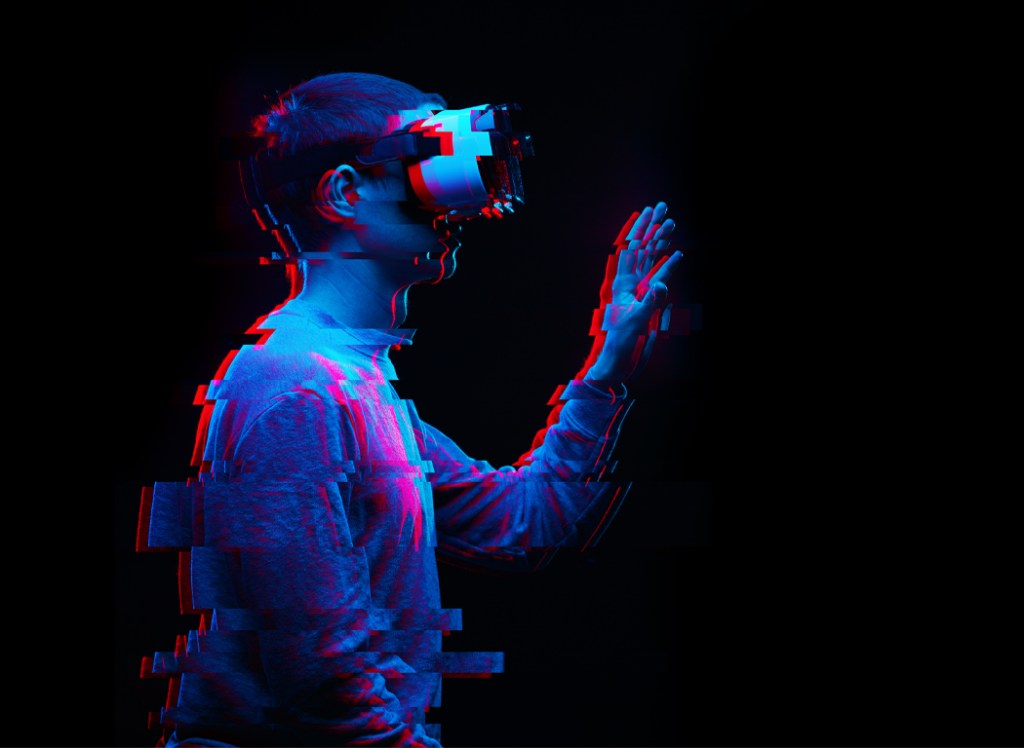 A young man explores using a virtual reality headset.