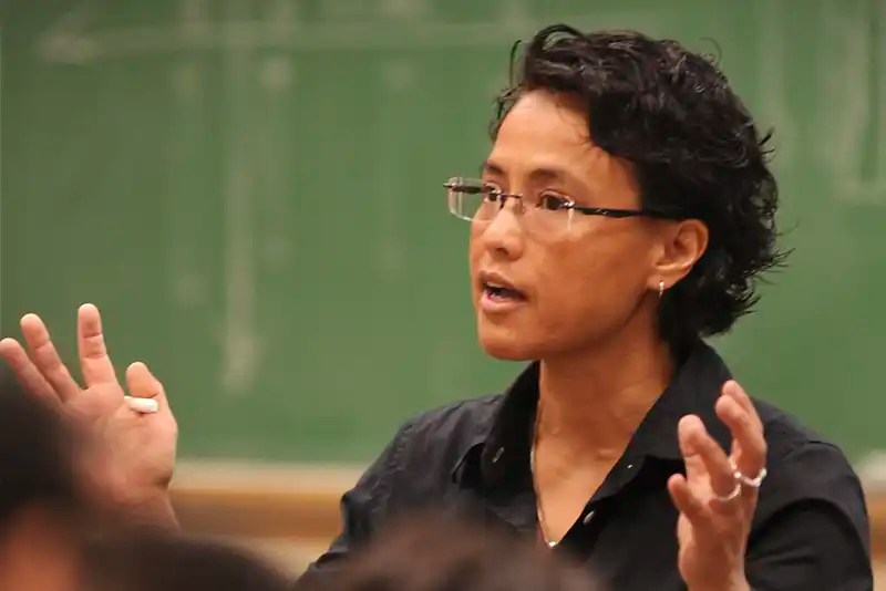 A teacher lectures in her classroom — NMSU Global Campus