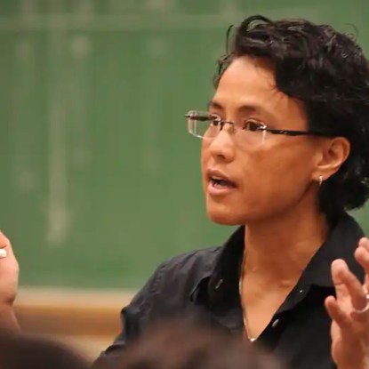 A teacher lectures in her classroom — NMSU Global Campus