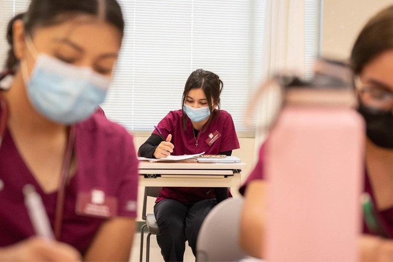 Nursing school students wearing masks in a classroom