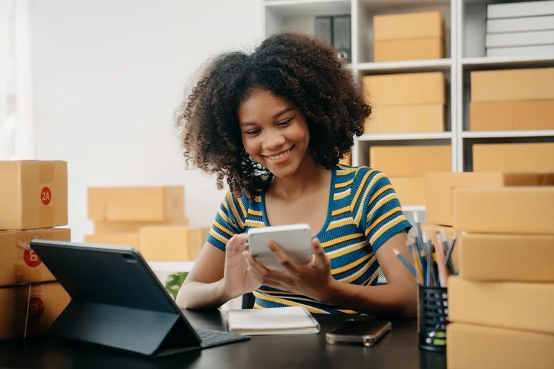Woman with a calculator at her business desk
