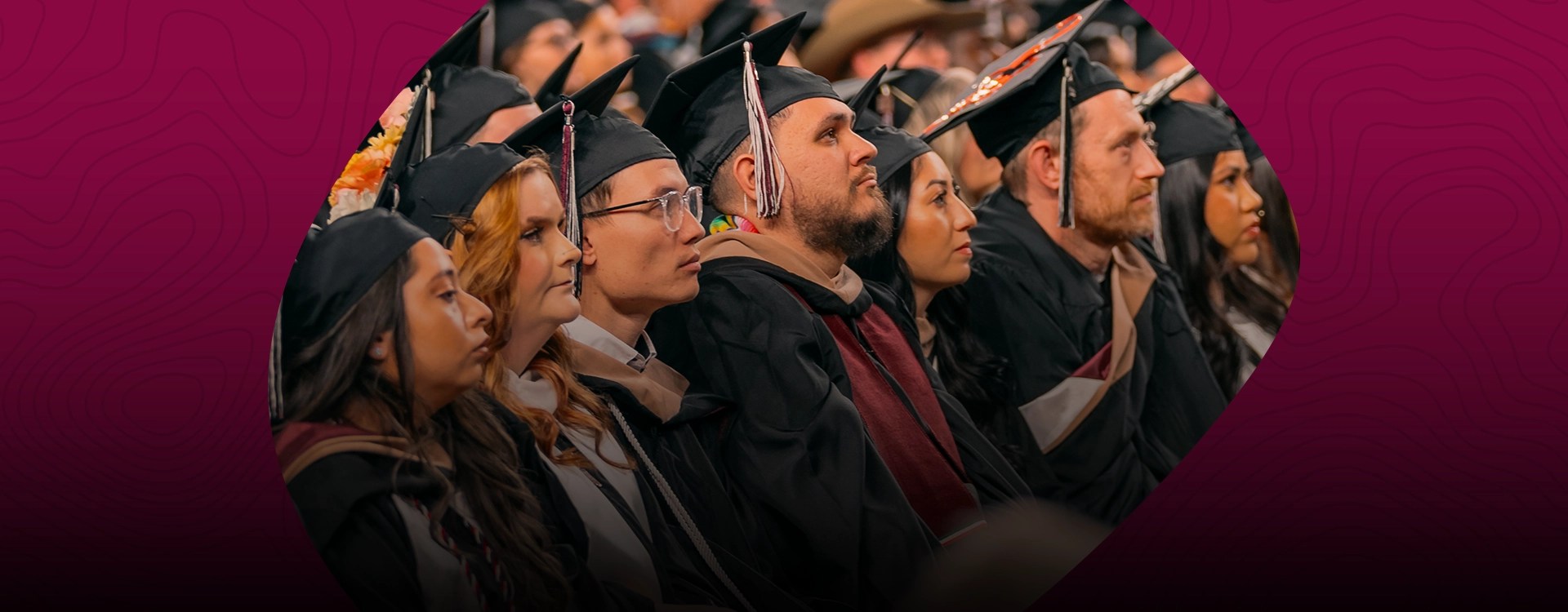 Commencement ceremony with students in graduation regalia at NMSU Global Campus
