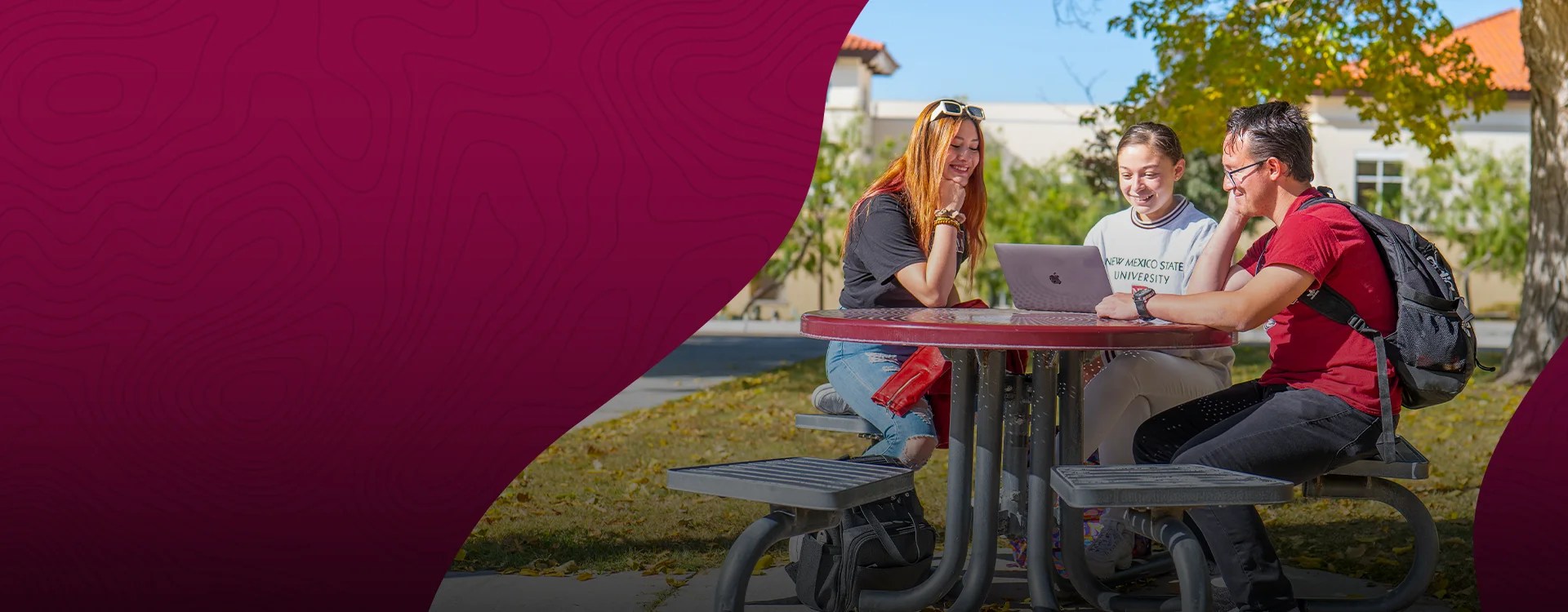 New Mexico State University students sit around an outdoor table chatting on a sunny day — NMSU Global Campus