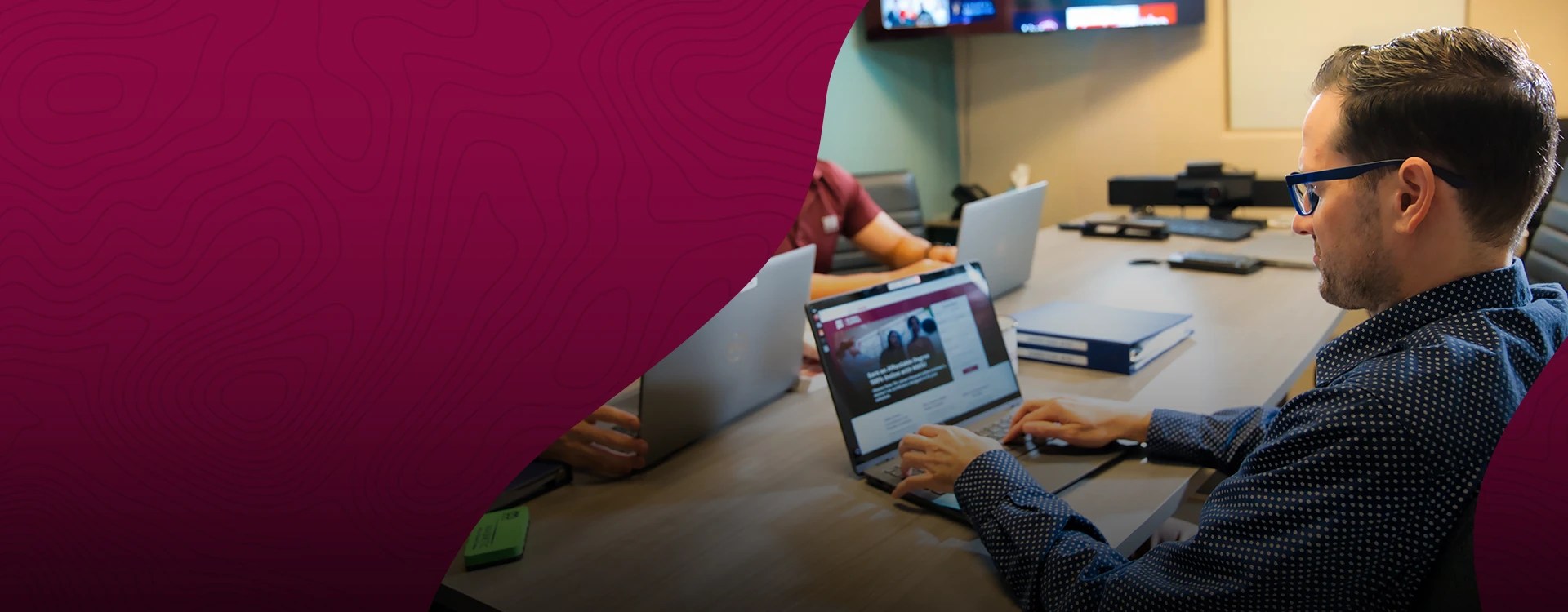 A man works on a laptop computer — NMSU Global Campus Workforce Development