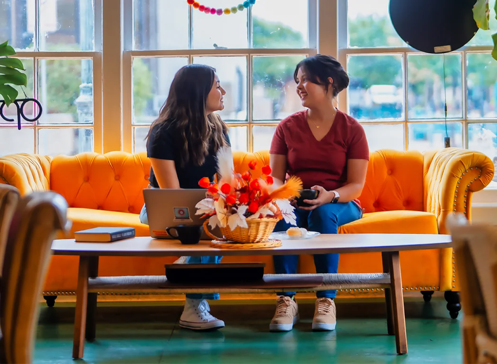 Two students chatting in a cafe — New Mexico State University Global Campus