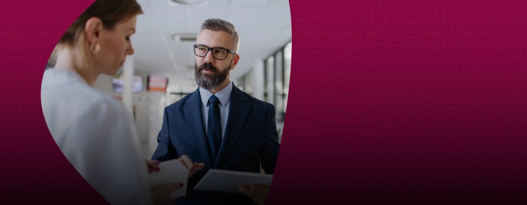 Two business professionals conversing — NMSU Global Campus