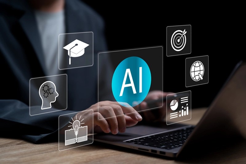 A person typing on a laptop computer using AI software